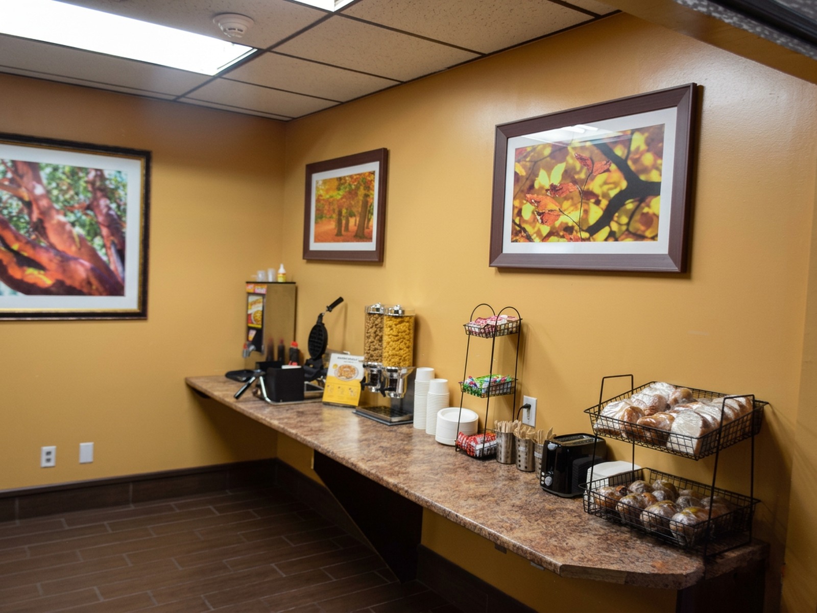 Breakfast counter with cereal dispensers at Timmins Inn & Suites